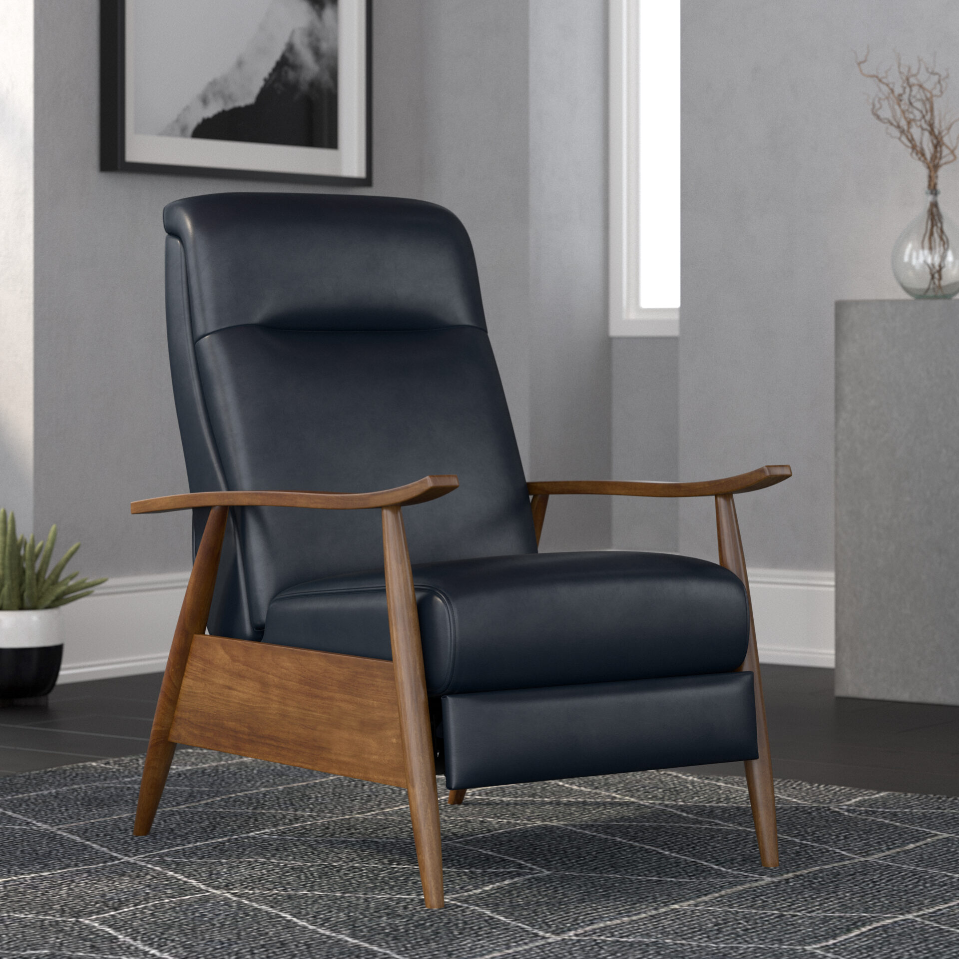 A dark gray chair with a wooden arm rest and legs