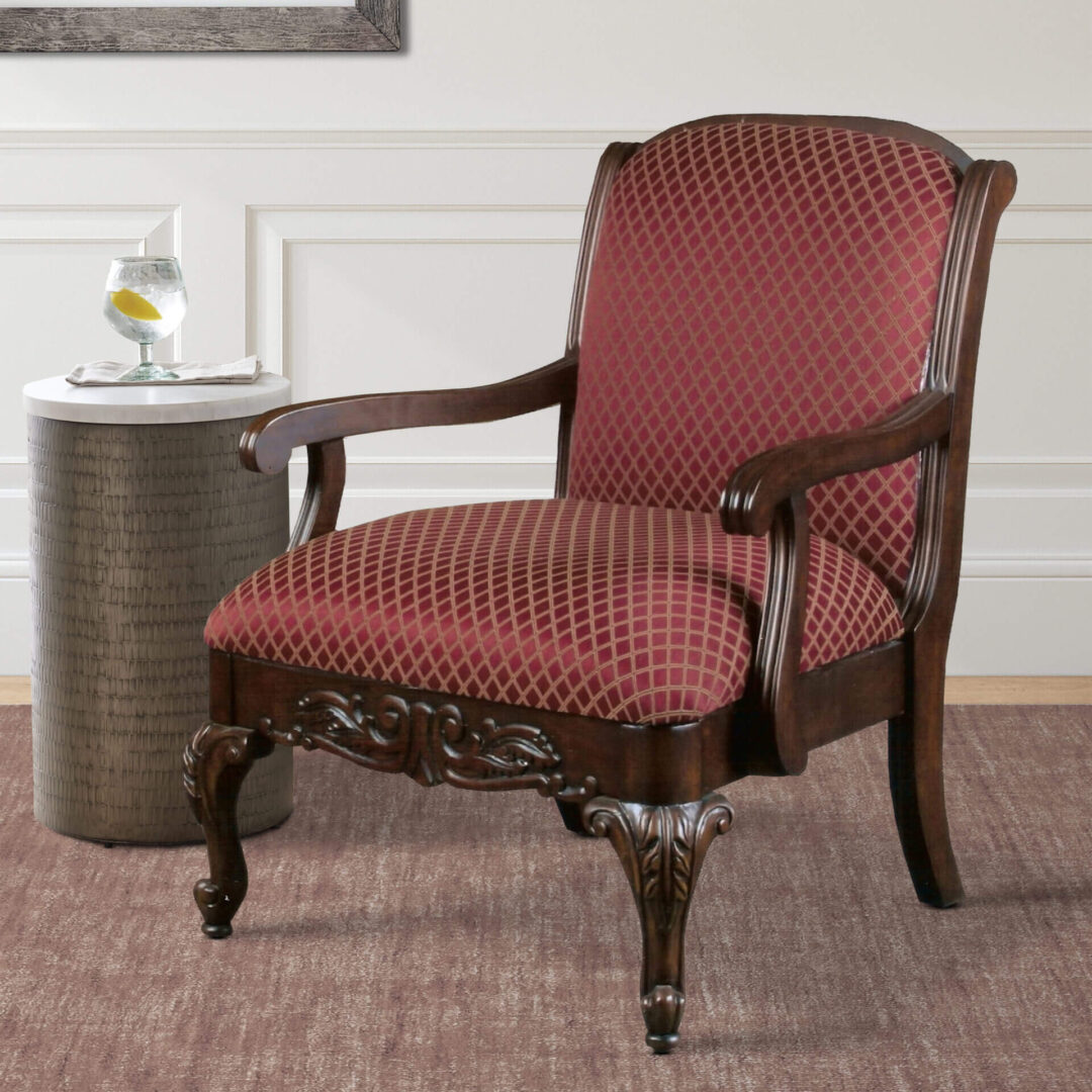 A red vintage chair with stripes and wooden legs