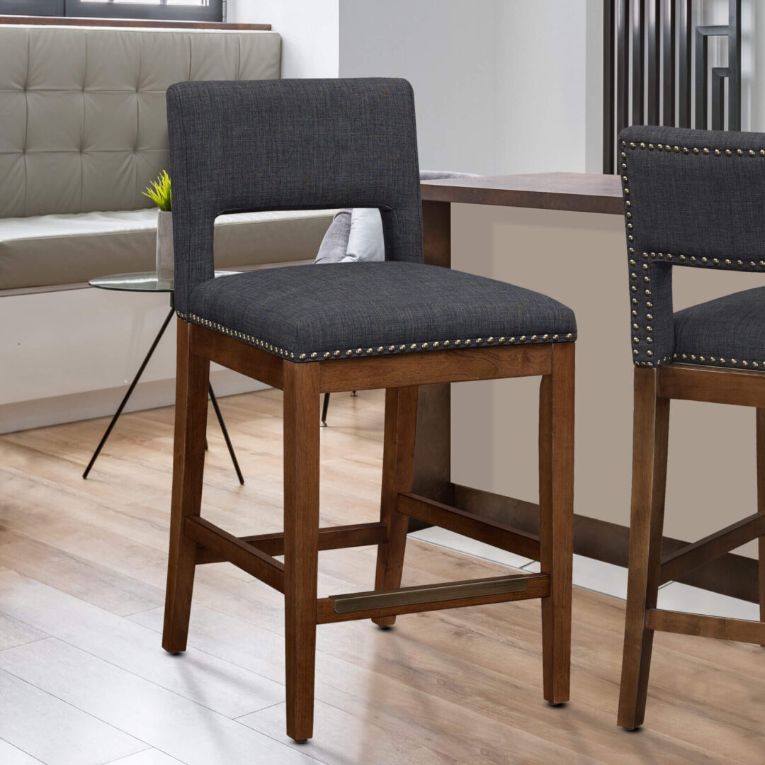 A dark blue chair with long wooden legs