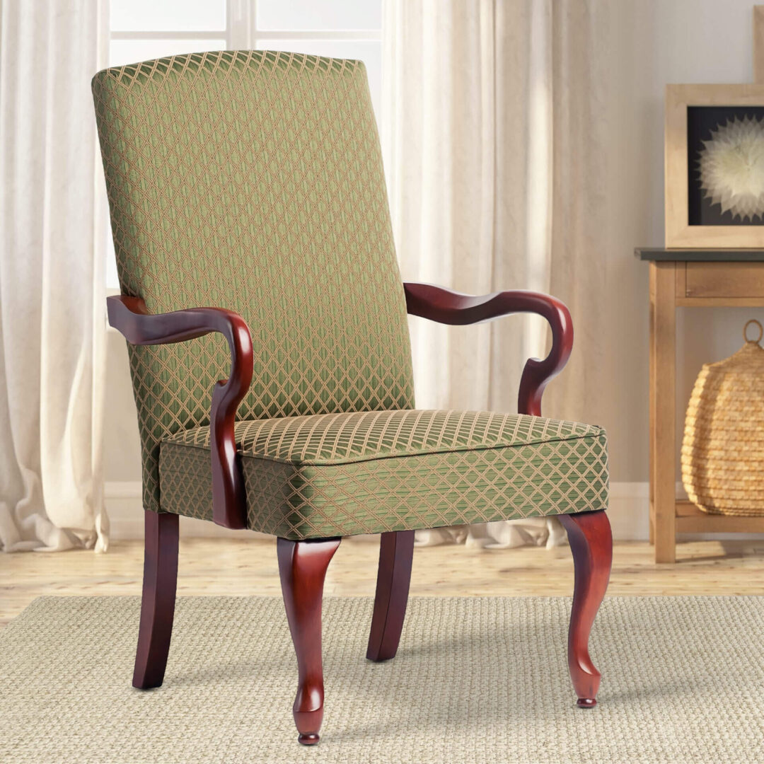 An olive green chair next to a wooden side table