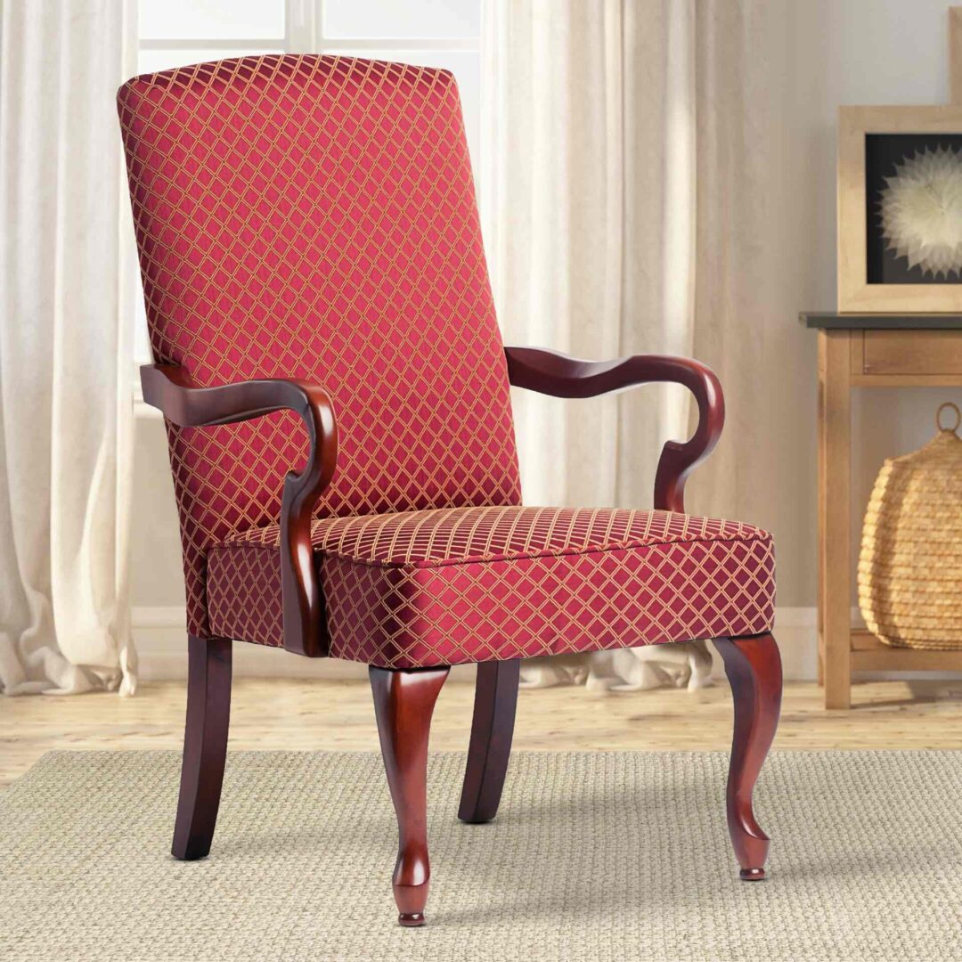 A red vintage chair with a long back and short legs