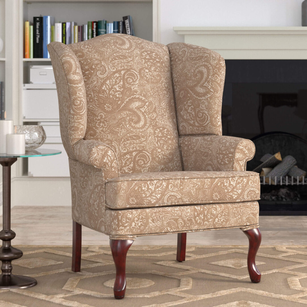 A paisley print chair with curved legs