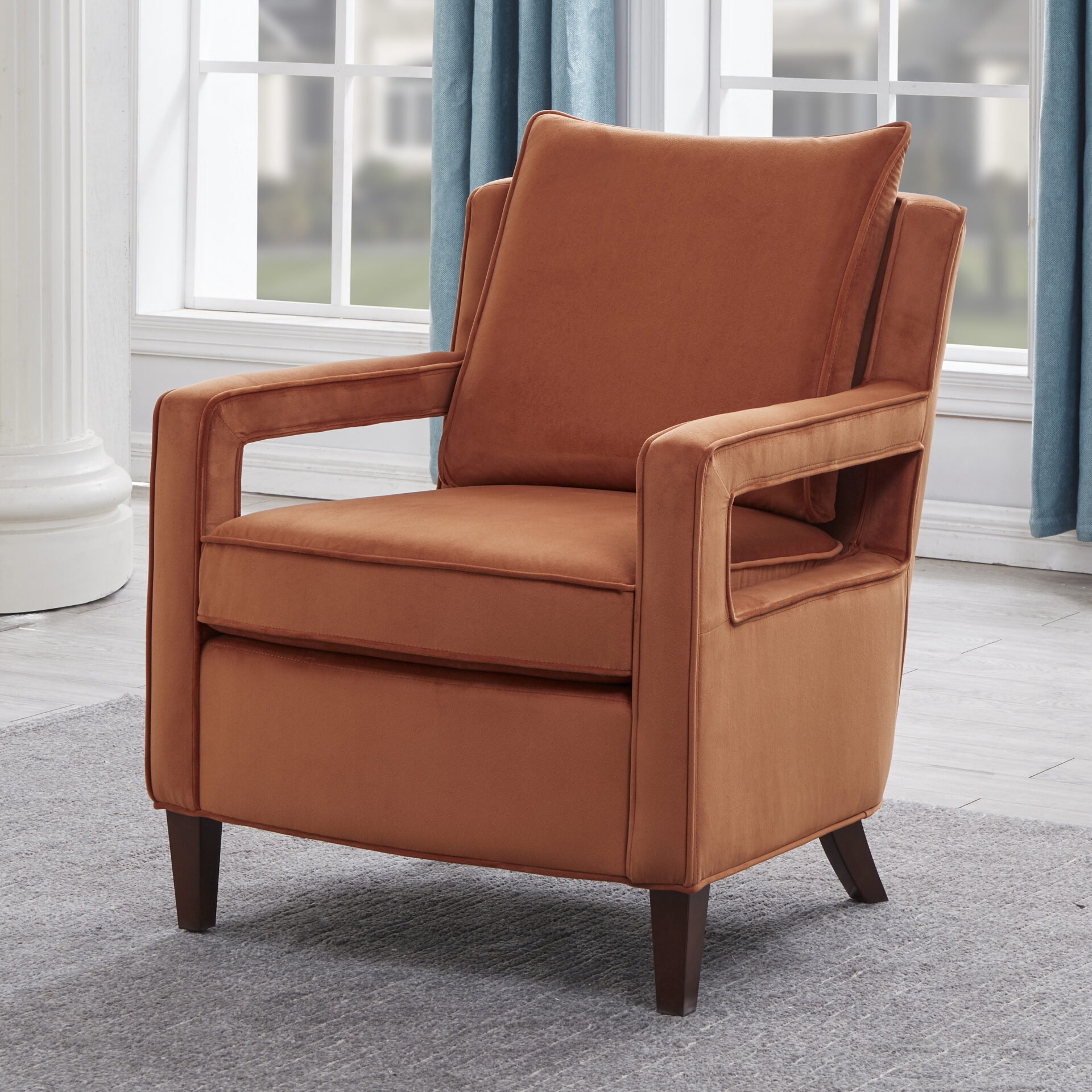 An orange color chair with soft cushion