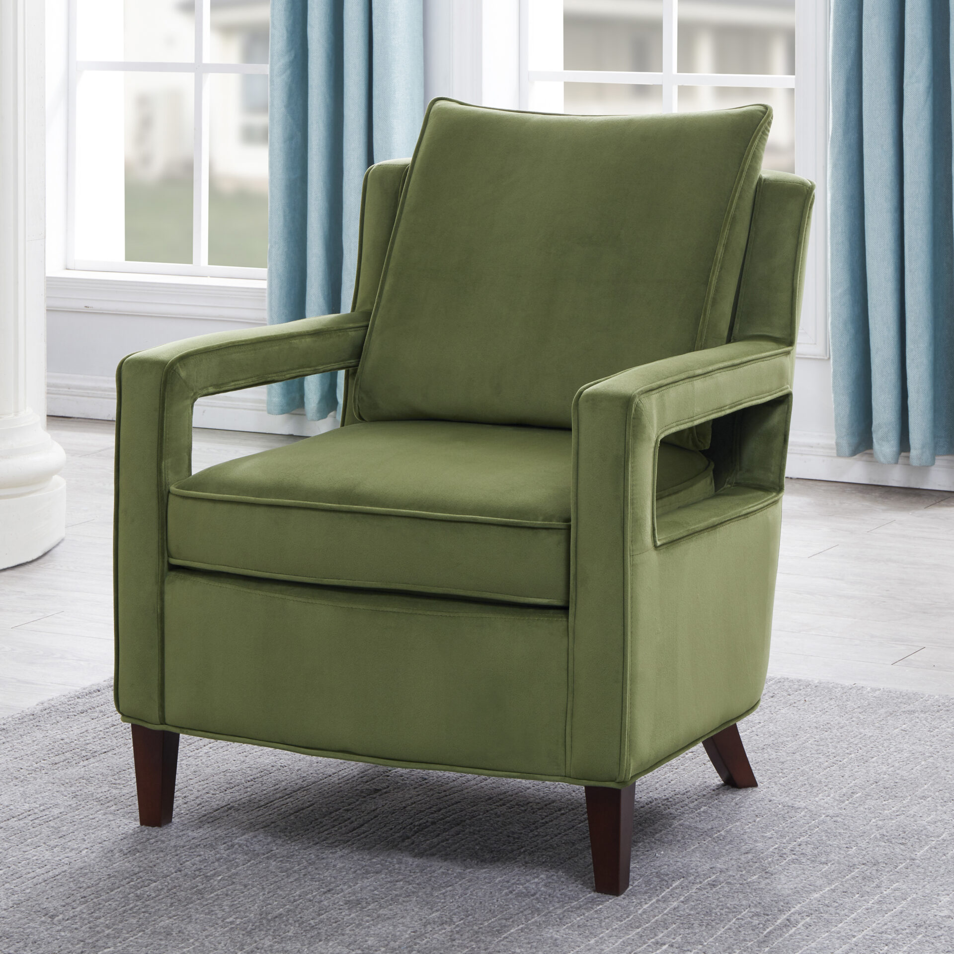 A green color chair with soft cushion